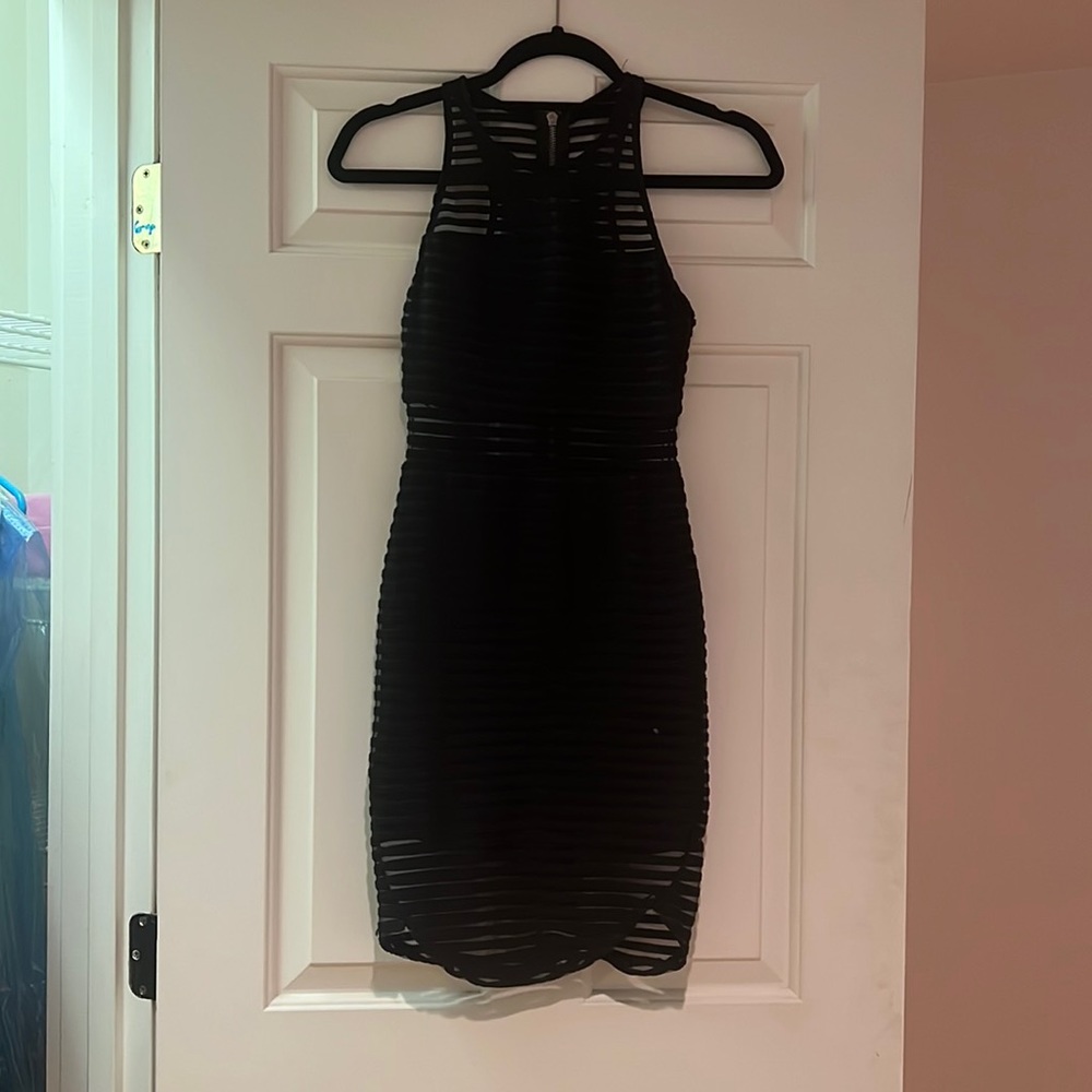 New dress, only worn once and dry cleaned. Black see through mesh in parts!